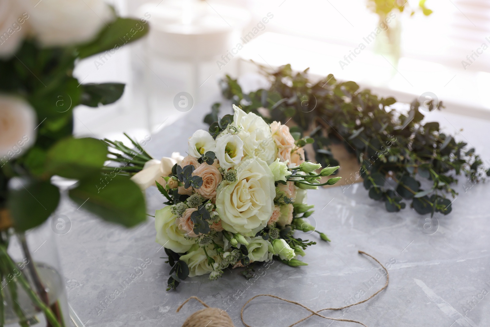 Photo of Beautiful wedding bouquet on light grey marble table