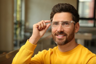 Portrait of handsome stylish man in office