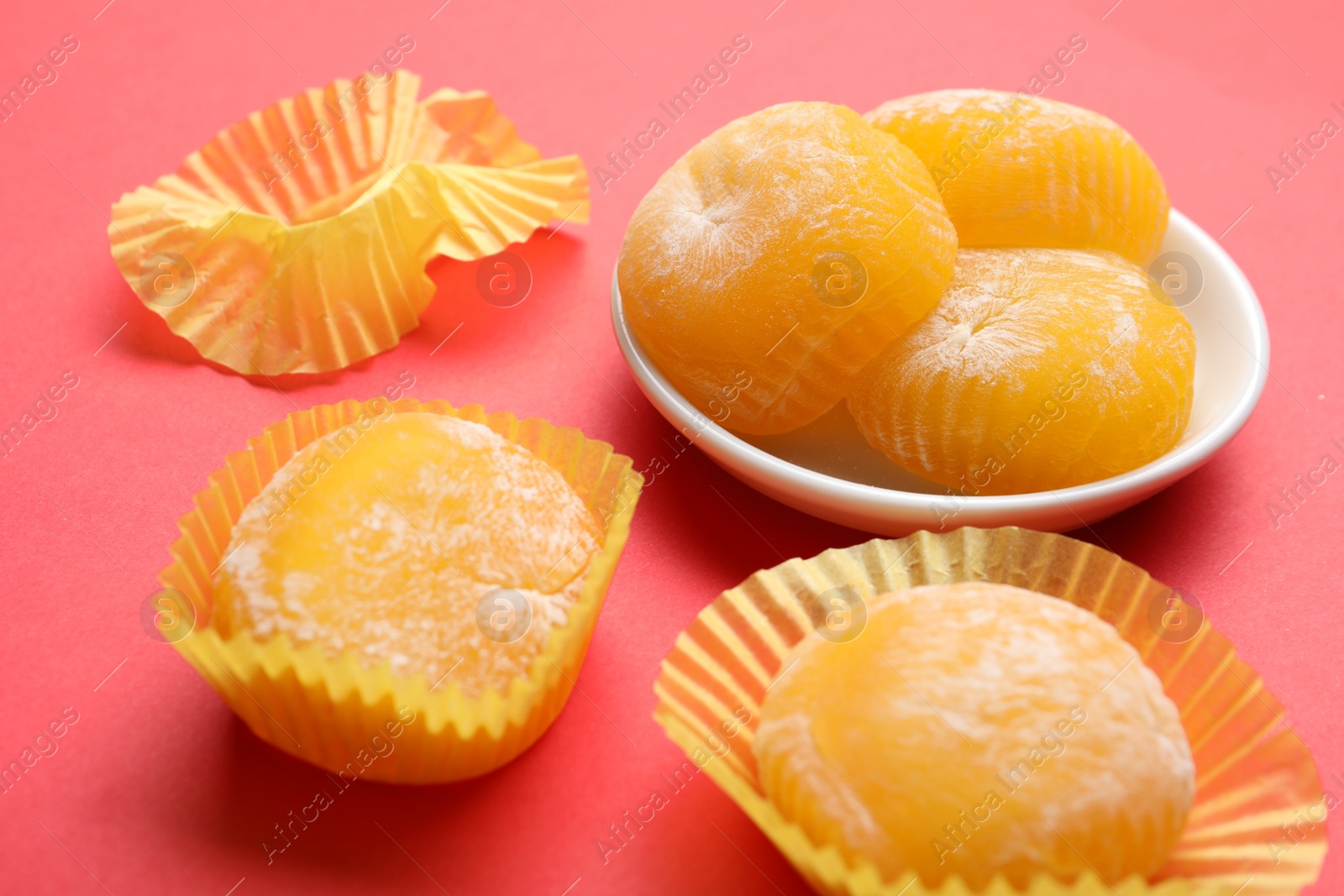 Photo of Delicious mochi on red background. Traditional Japanese dessert