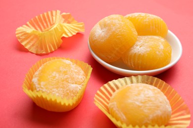 Delicious mochi on red background. Traditional Japanese dessert