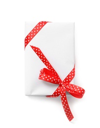 Photo of Christmas gift box decorated with red bow isolated on white, top view