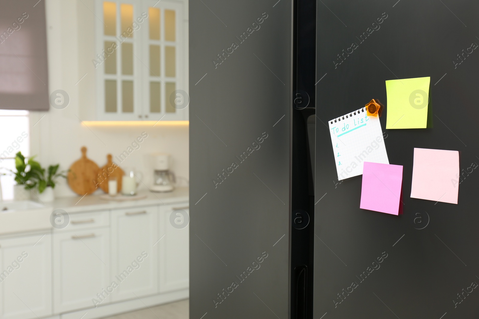Photo of Blank To do list and sticky notes on fridge in kitchen. Space for text