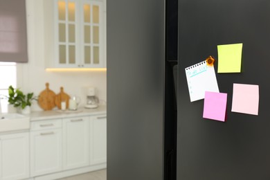 Photo of Blank To do list and sticky notes on fridge in kitchen. Space for text