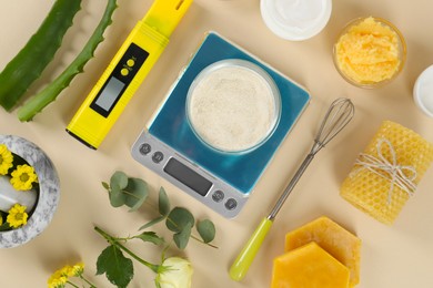 Photo of Flat lay composition with homemade cosmetic products and fresh ingredients on beige background