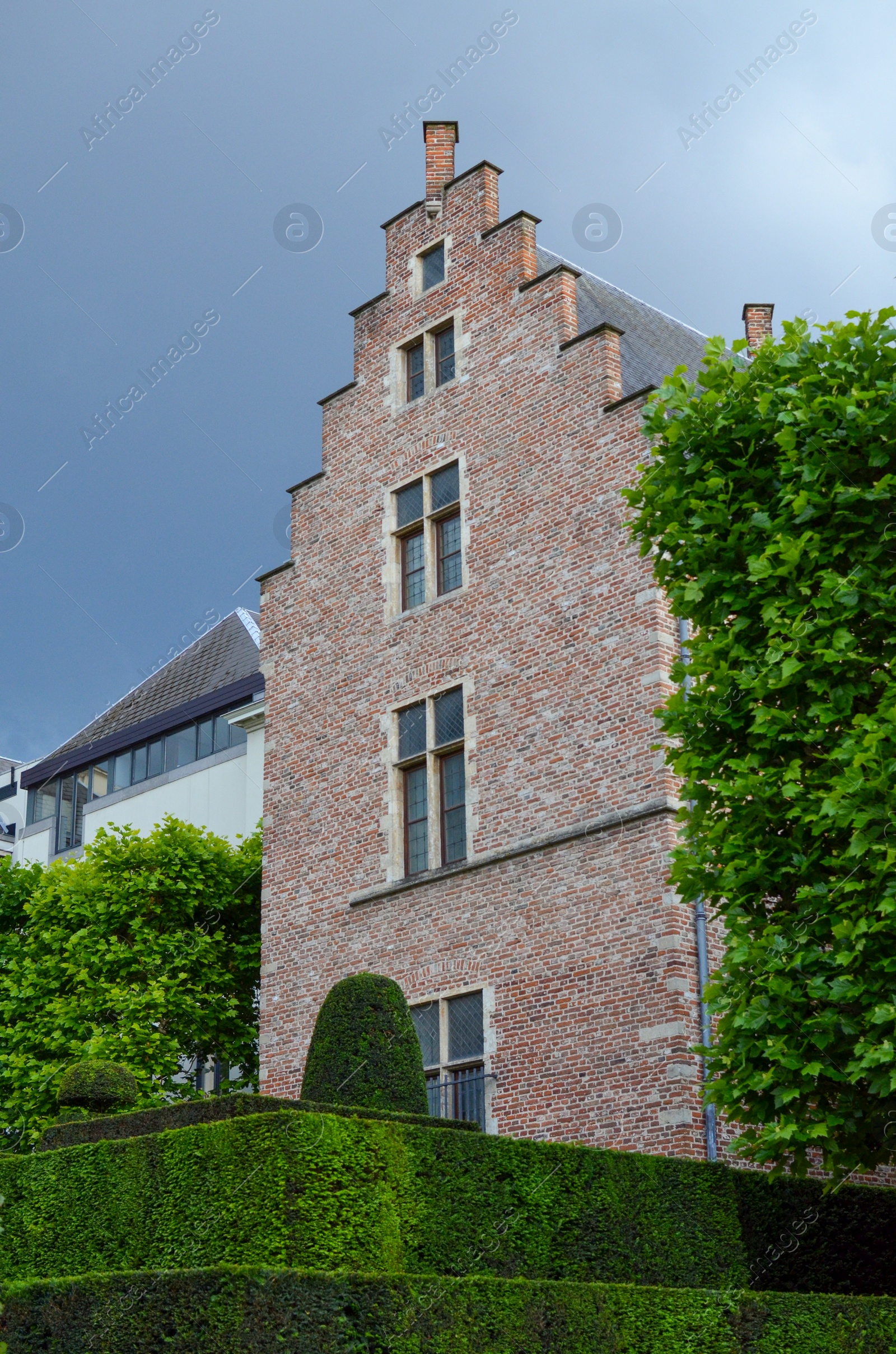 Photo of Picturesque view of town with beautiful buildings and green plants