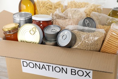 Donation box full of different food , closeup