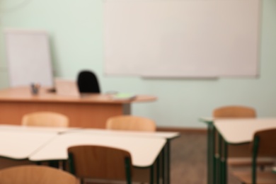 Photo of Blurred view of empty modern classroom at school