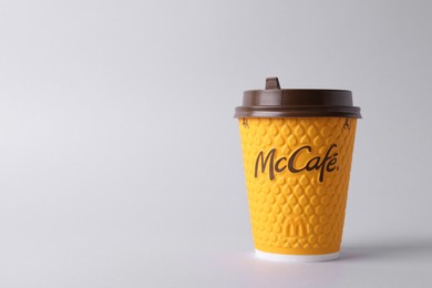 Photo of MYKOLAIV, UKRAINE - AUGUST 12, 2021: Hot McDonald's drink on light background. Space for text