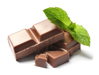 Pieces of milk chocolate with mint on white background