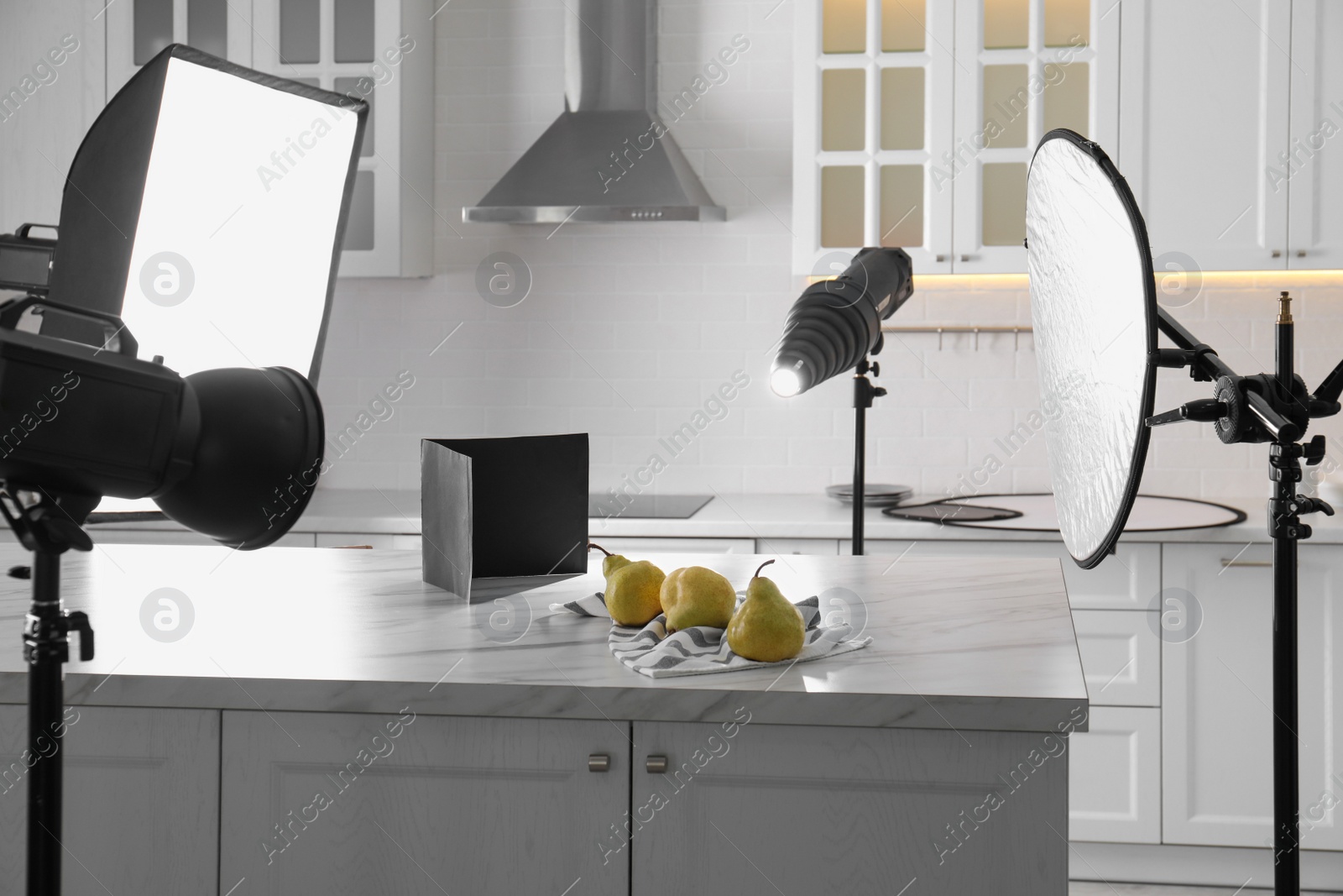 Photo of Professional equipment and many pears on table in kitchen. Food photo