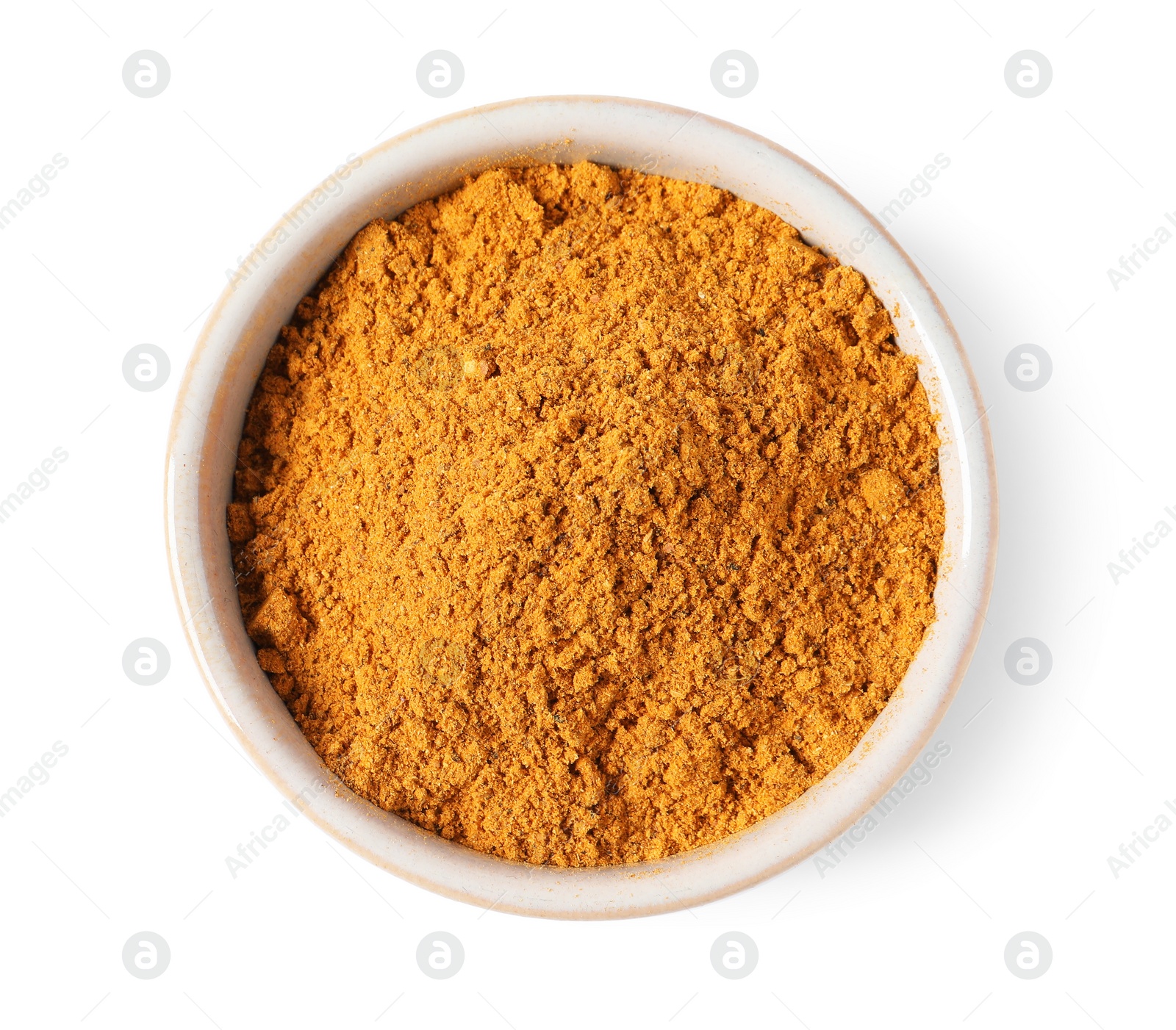 Photo of Curry powder in bowl isolated on white, top view