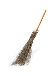 Photo of Old broom with wooden handle isolated on white