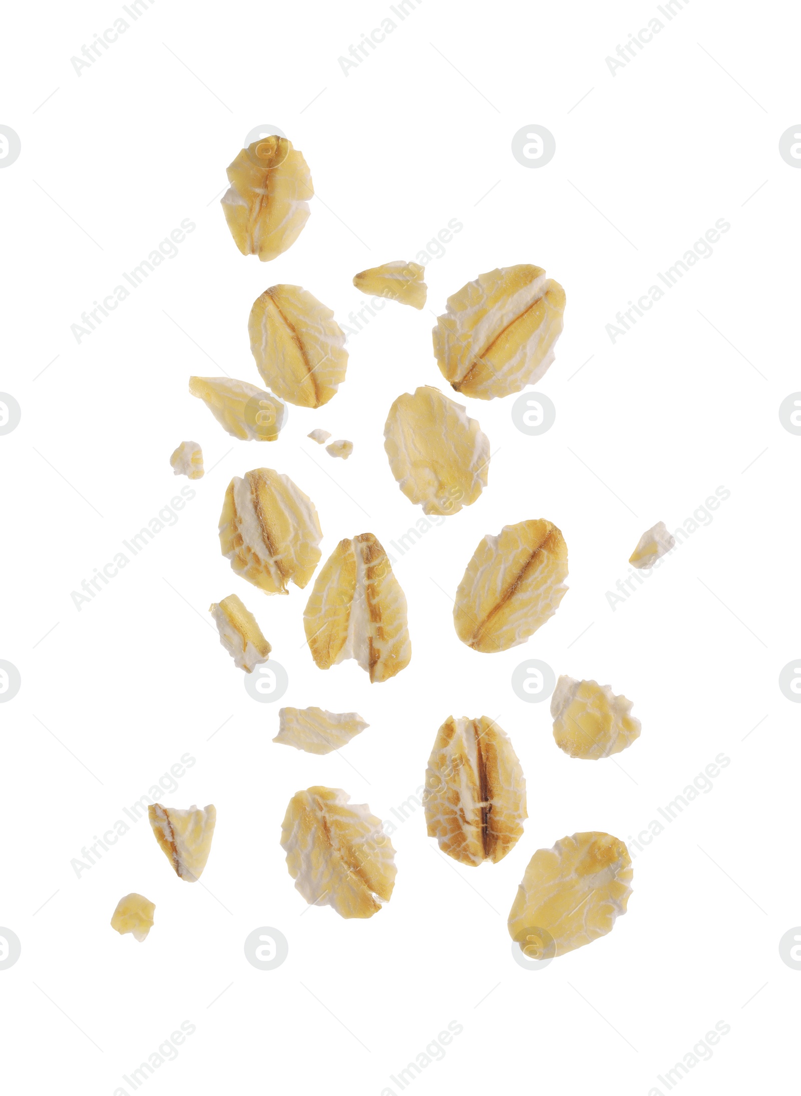 Photo of Dry oat flakes falling on white background