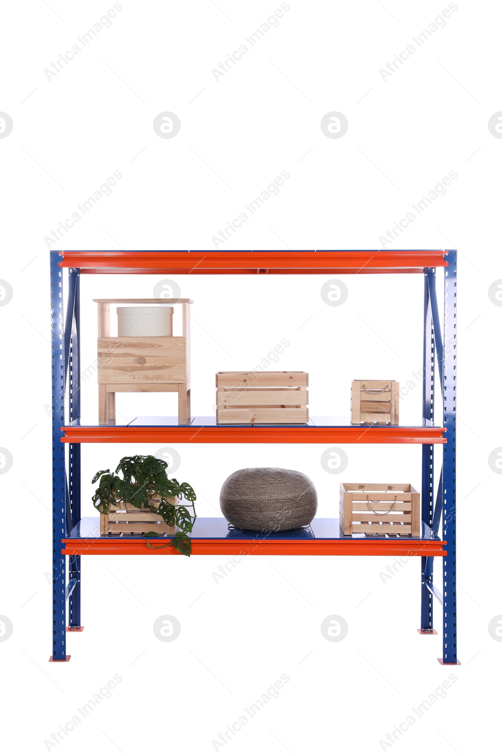 Photo of Bright metal shelving unit with wooden crates and houseplant on white background