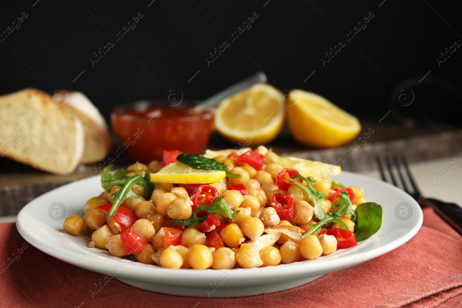 Photo of Delicious fresh chickpea salad served on table