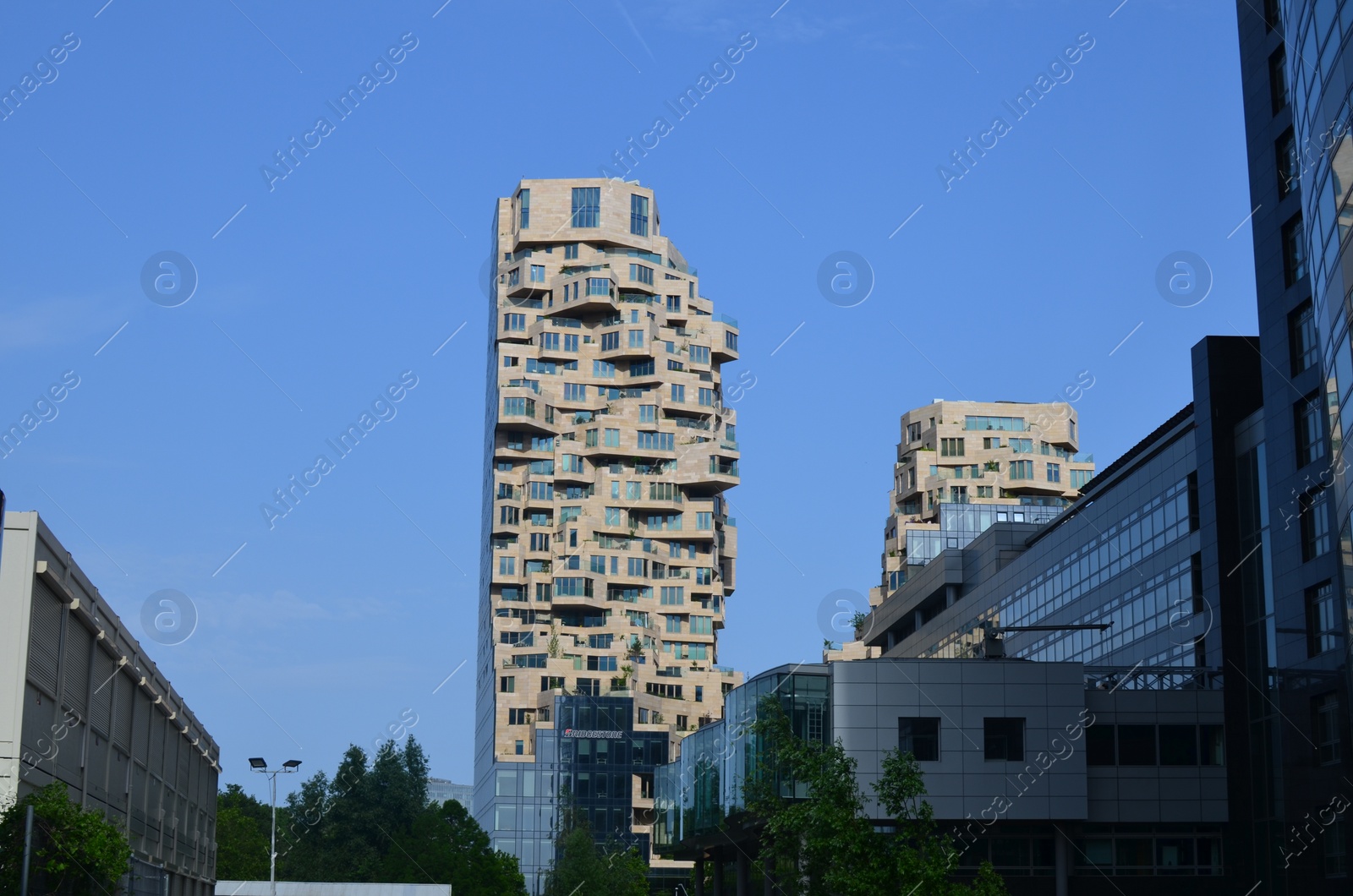 Photo of Exterior of beautiful modern skyscrapers against blue sky