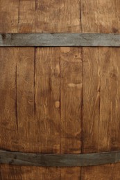 Photo of Traditional wooden barrel as background, closeup. Wine making