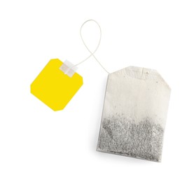 Photo of Paper tea bag with tag isolated on white, top view