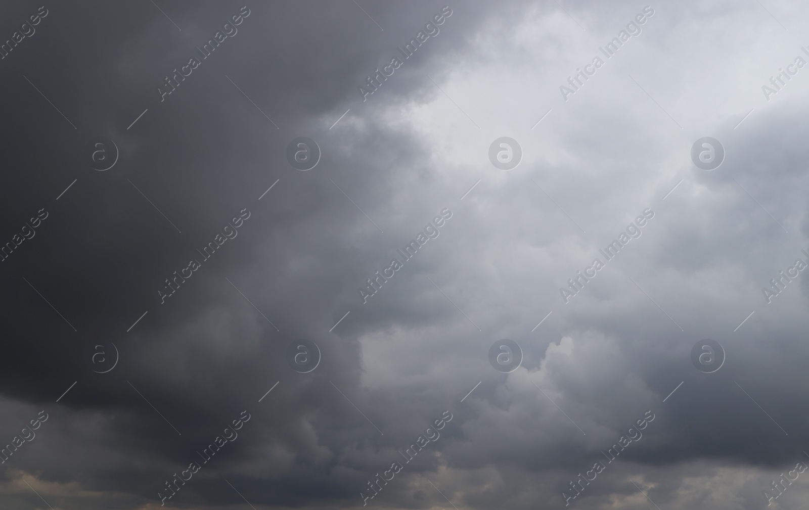 Photo of Sky with heavy rainy clouds on grey day