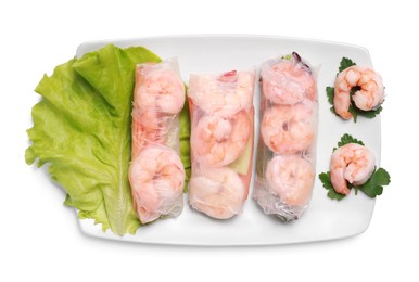 Photo of Delicious spring rolls with shrimps wrapped in rice paper on white background, top view
