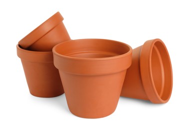 Photo of Empty clay flower pots isolated on white