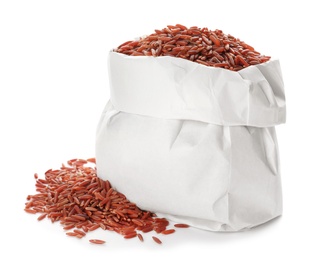 Photo of Bag with brown rice on white background