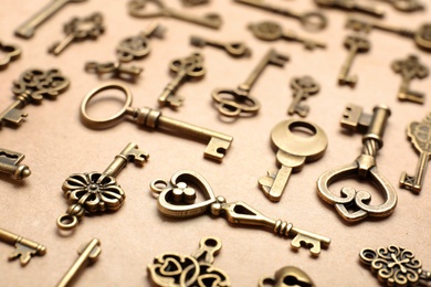 Photo of Old vintage keys on craft paper, closeup