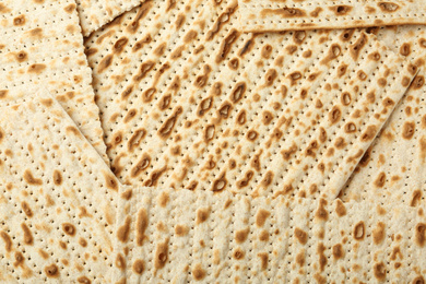Photo of Traditional Matzos as background, top view. Pesach (Passover) celebration