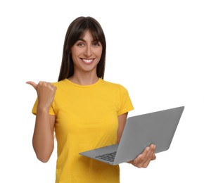 Special promotion. Happy woman with laptop pointing at something on white background