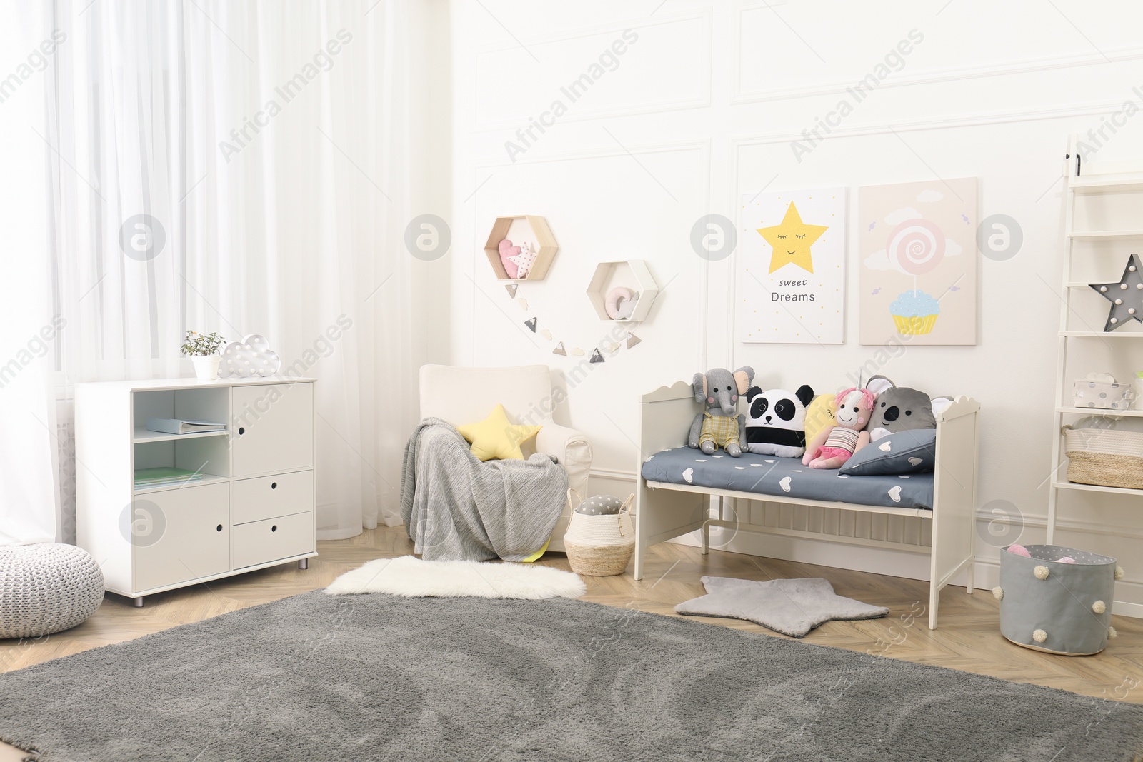 Photo of Child room interior with toys and stylish furniture