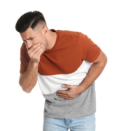 Photo of Man suffering from stomach ache and nausea on white background. Food poisoning