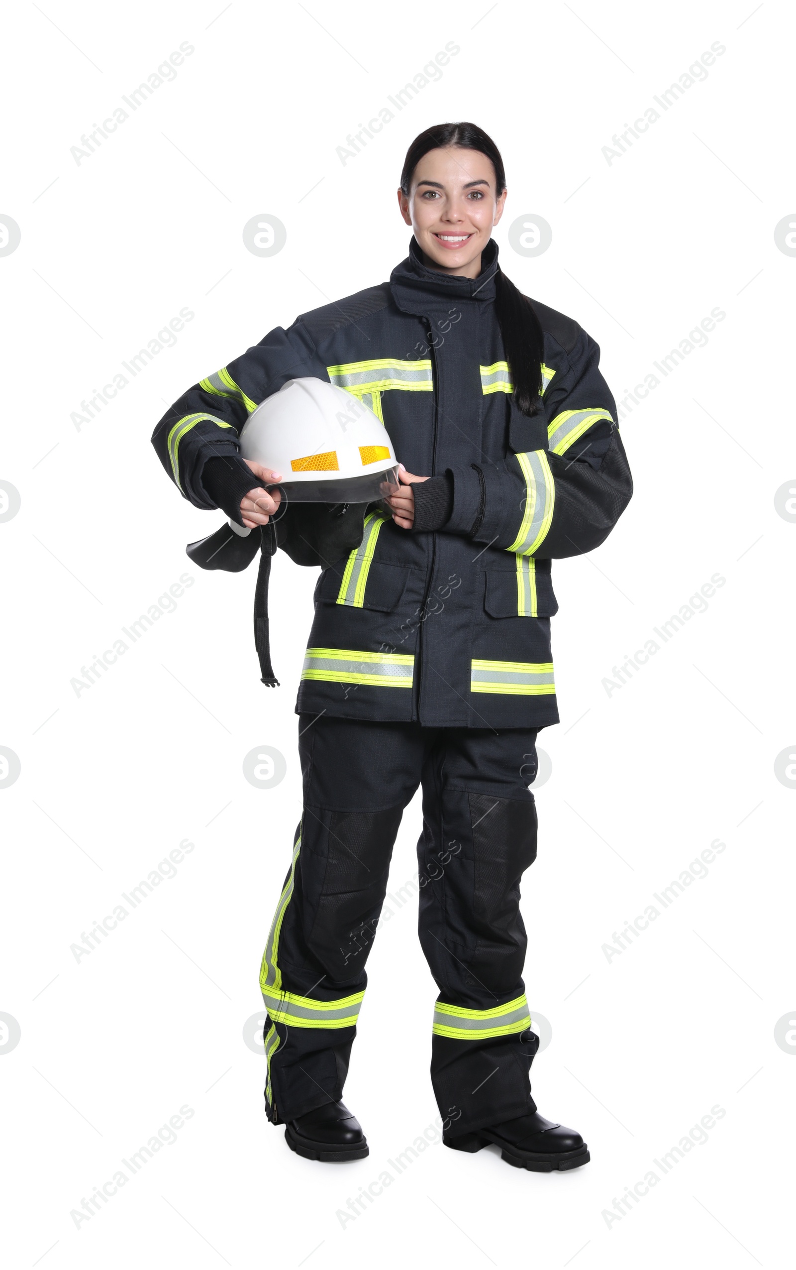 Photo of Full length portrait of firefighter in uniform with helmet on white background