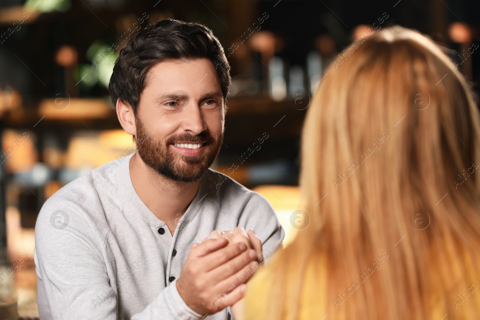 Photo of Romantic date. Happy couple spending time together in cafe