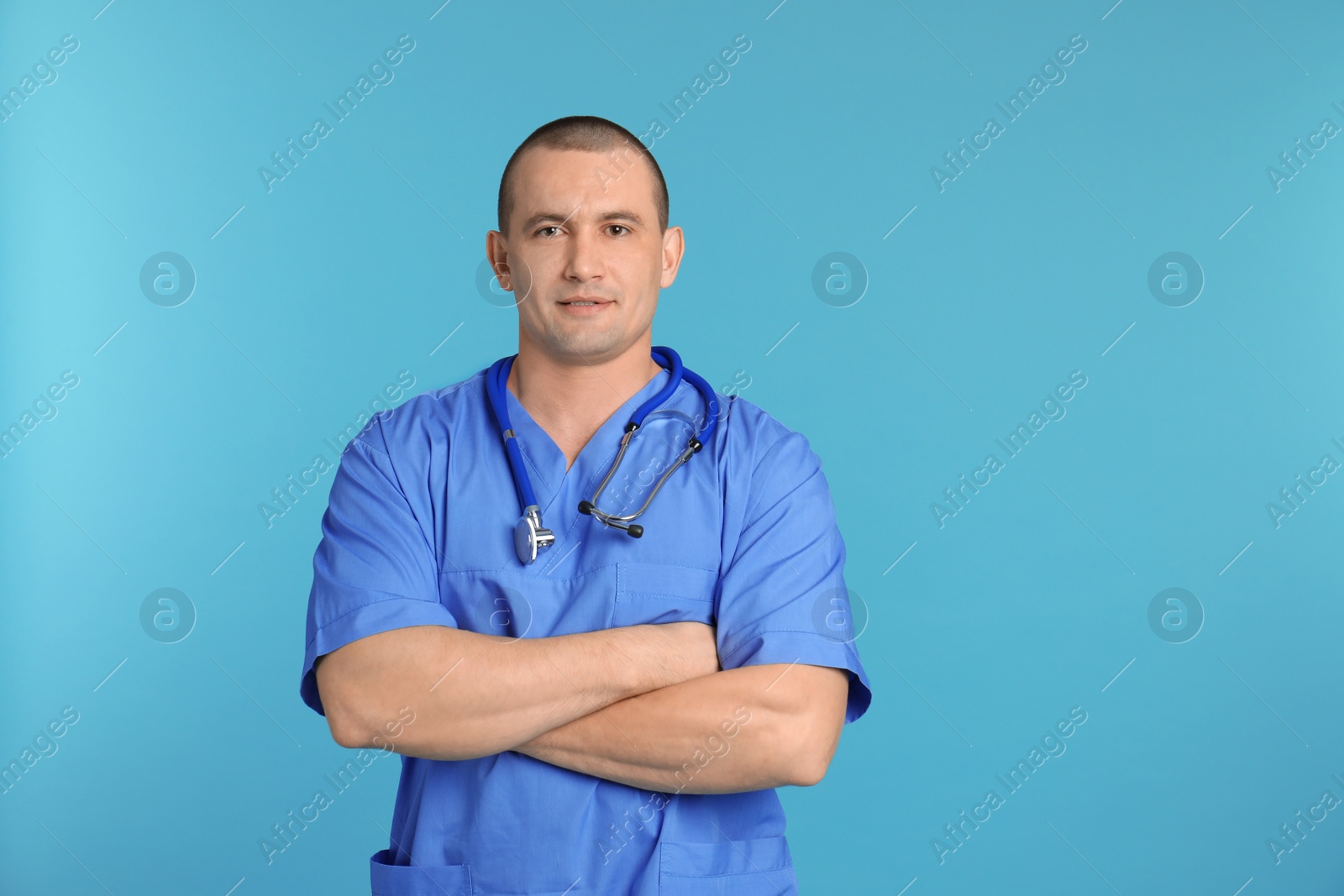 Photo of Portrait of medical assistant with stethoscope on color background