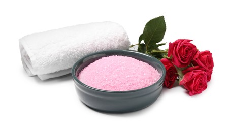 Photo of Pink sea salt in bowl, roses and towel isolated on white