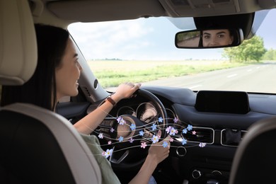 Image of Woman enjoying driving car feeling flower scent from ventilation, closeup. Air freshener