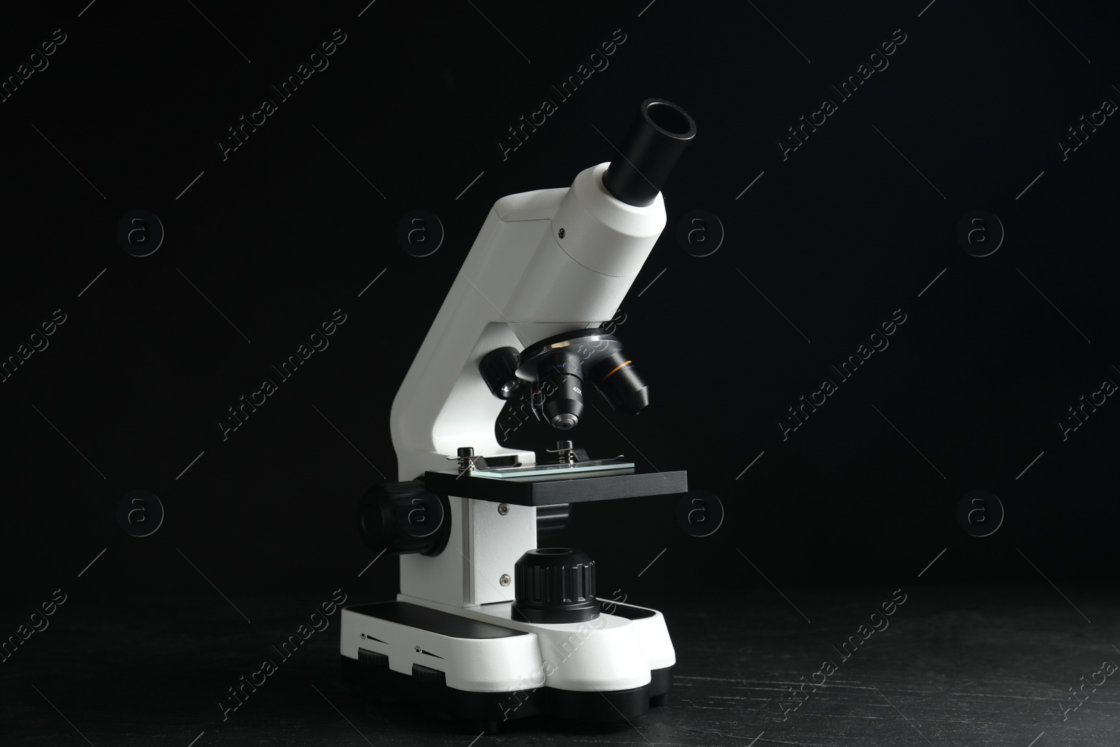 Photo of Modern microscope on black background. Medical equipment