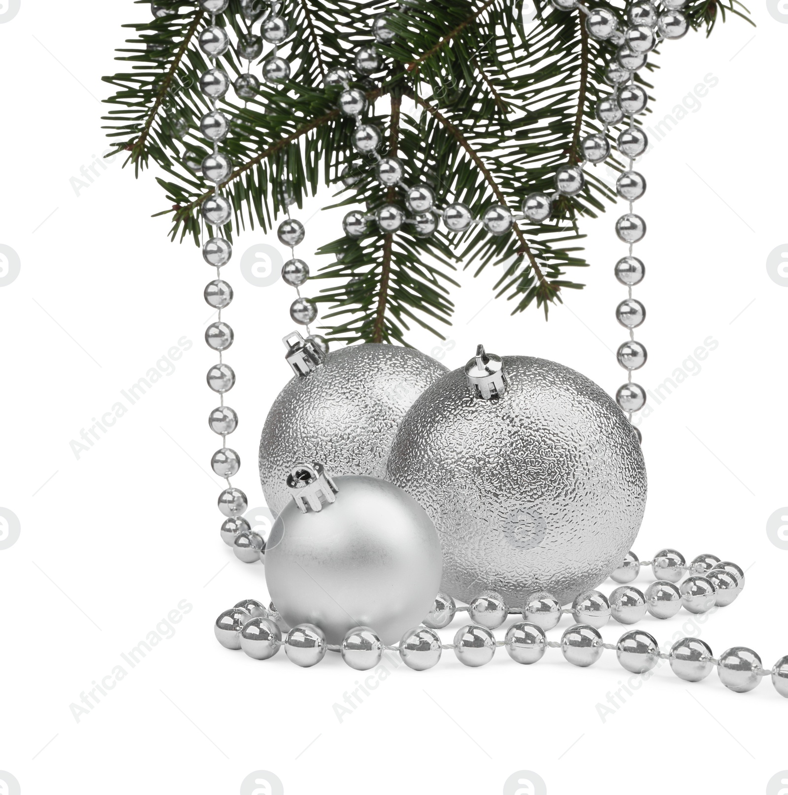 Photo of Silver Christmas balls, fir branches and beads isolated on white