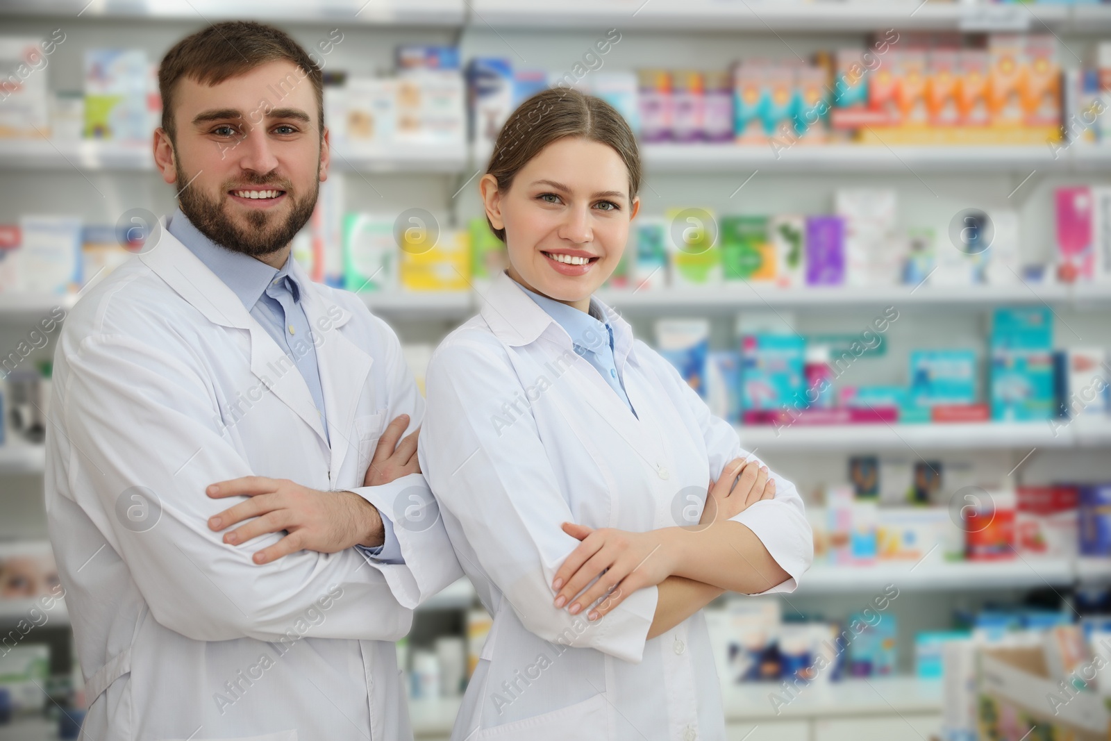 Photo of Portrait of professional pharmacists in modern drugstore