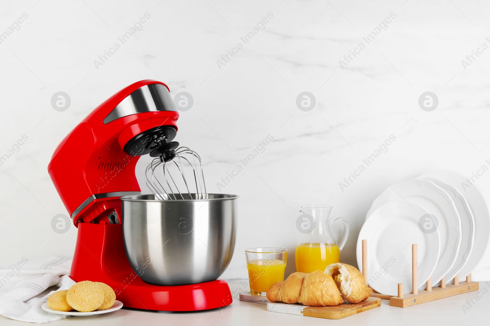 Photo of Composition with modern red stand mixer and different products on white table