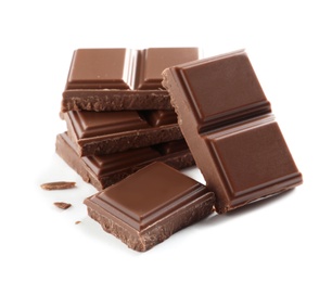 Photo of Pieces of tasty milk chocolate on white background