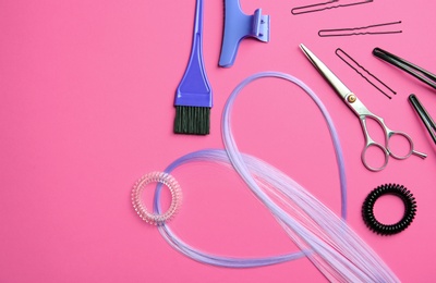 Flat lay composition with hair salon tools on color background