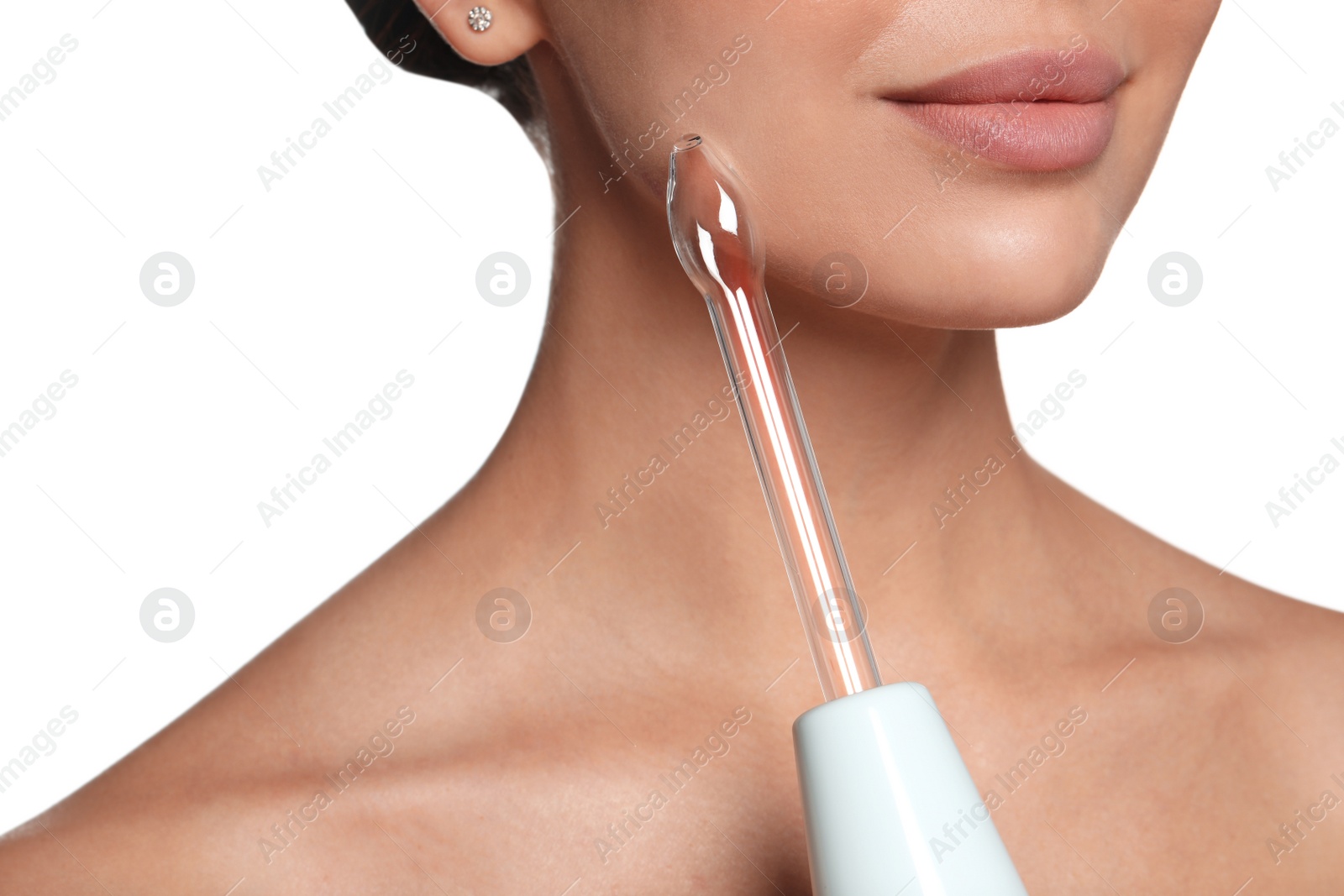 Photo of Woman using high frequency darsonval device on white background, closeup