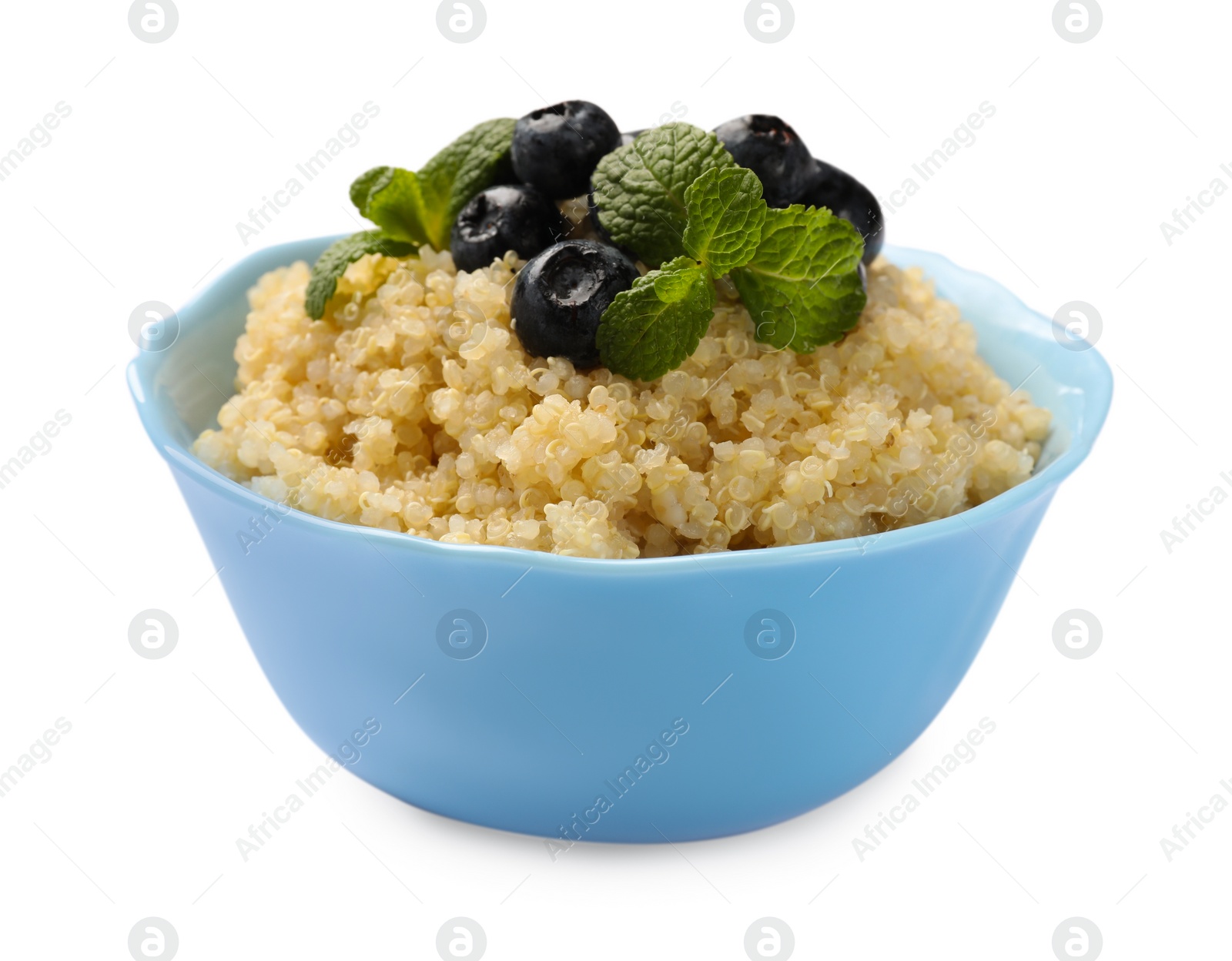 Photo of Tasty quinoa porridge with blueberries and mint in bowl isolated on white