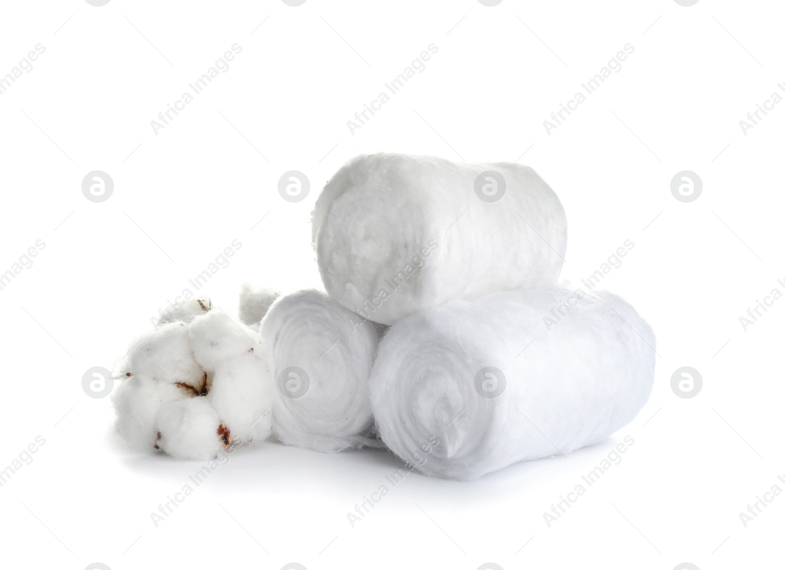 Photo of Fluffy cotton rolls and flower on white background