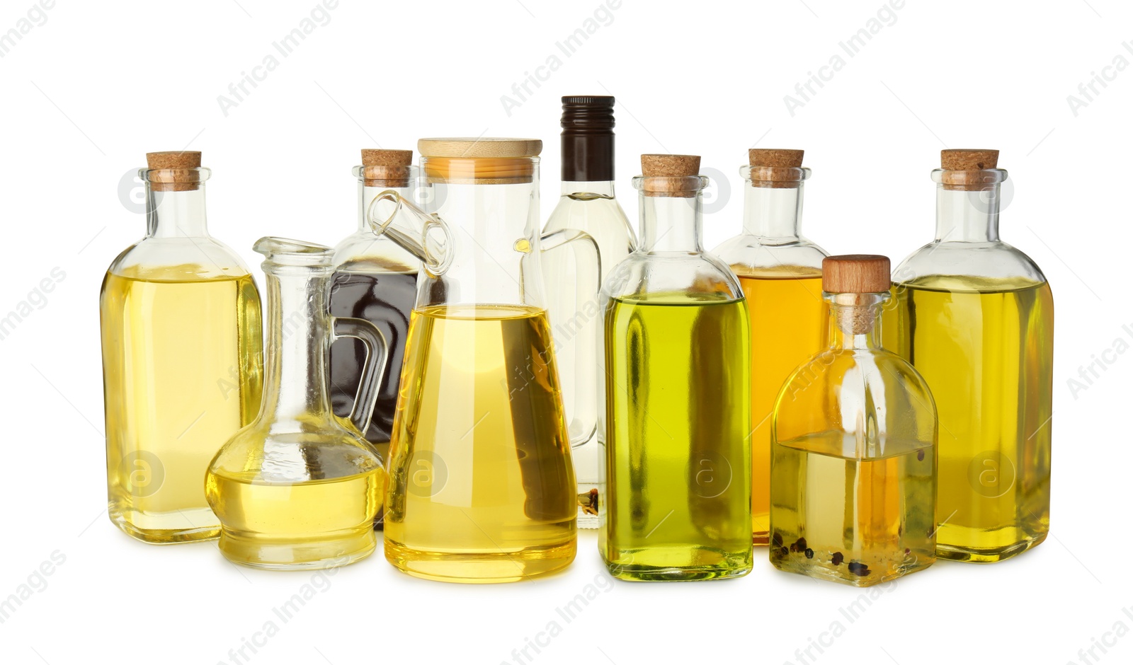 Photo of Vegetable fats. Glassware of different cooking oils isolated on white