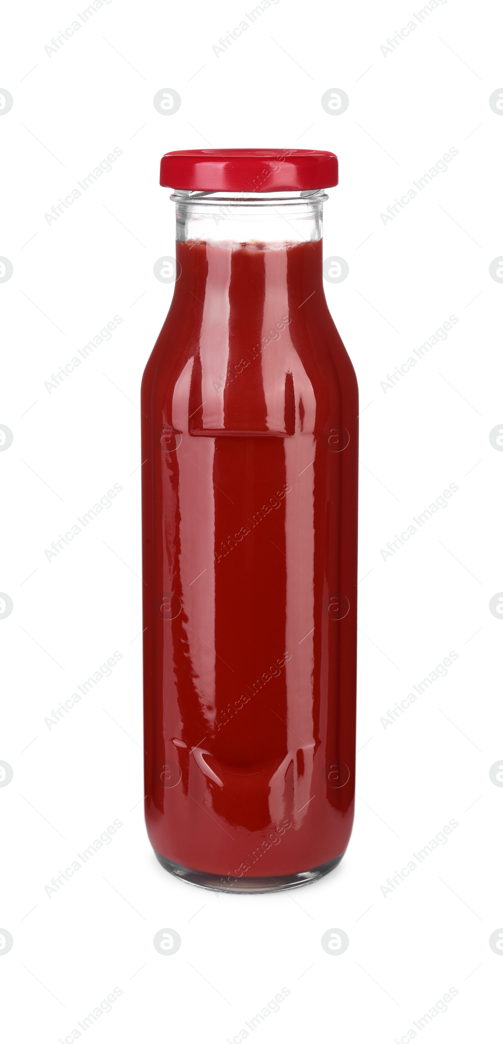 Photo of Glass bottle of tasty ketchup isolated on white