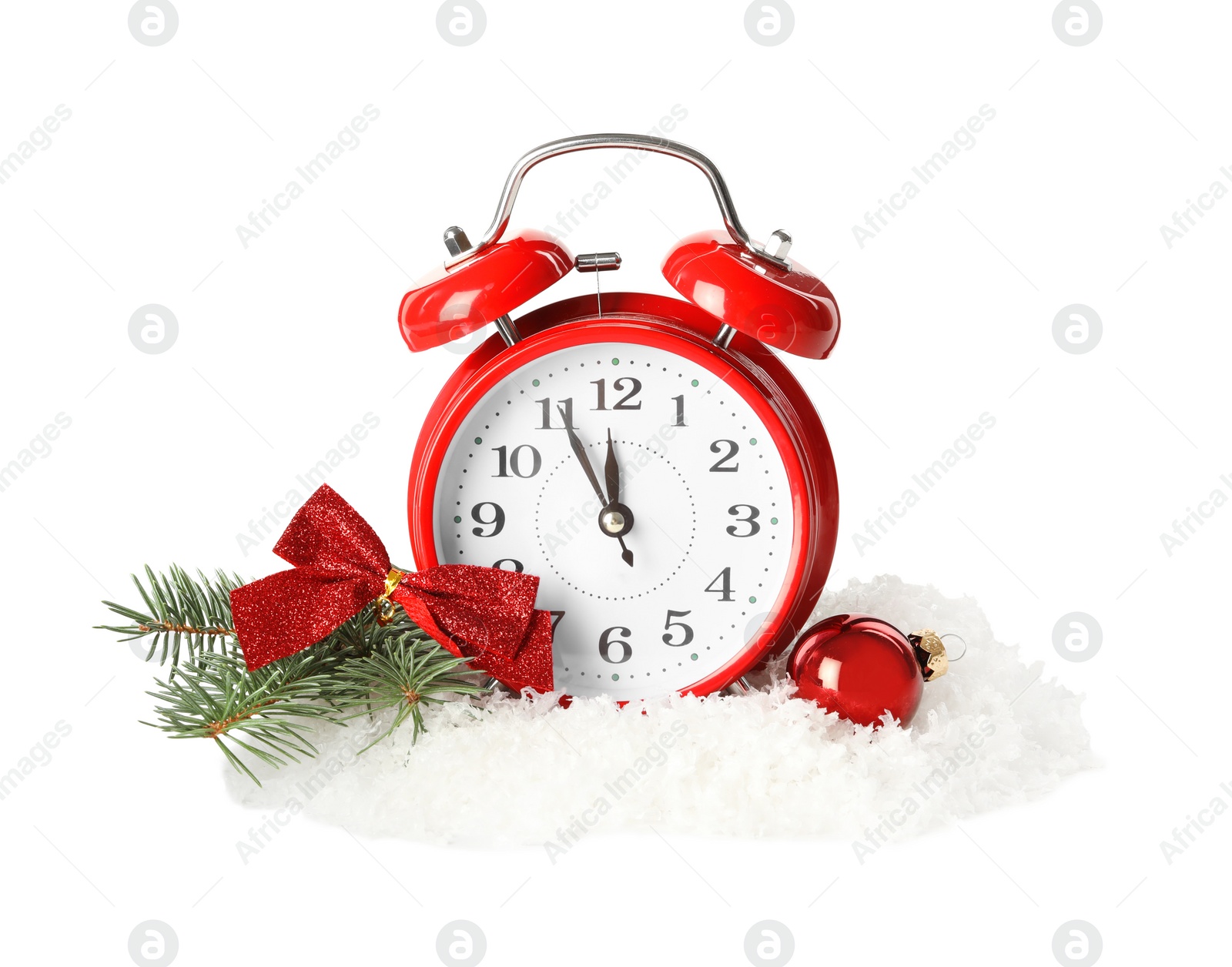 Photo of Alarm clock and festive decor in pile of snow on white background. New Year countdown