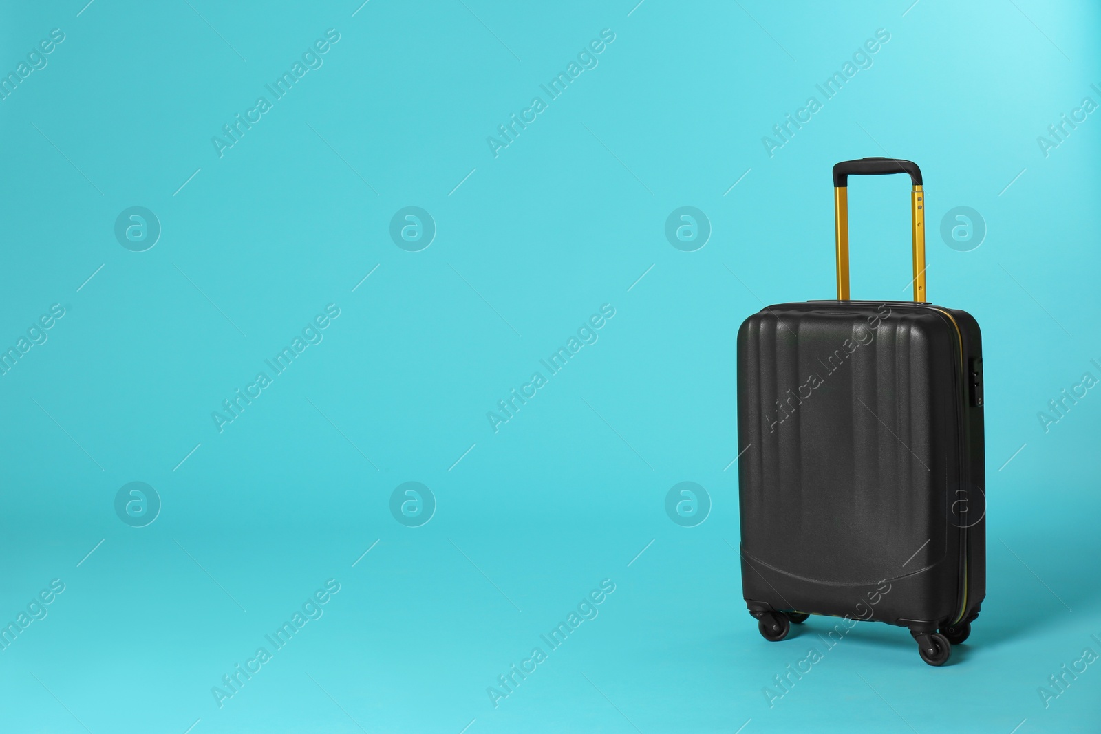 Photo of Stylish suitcase on color background. Space for text