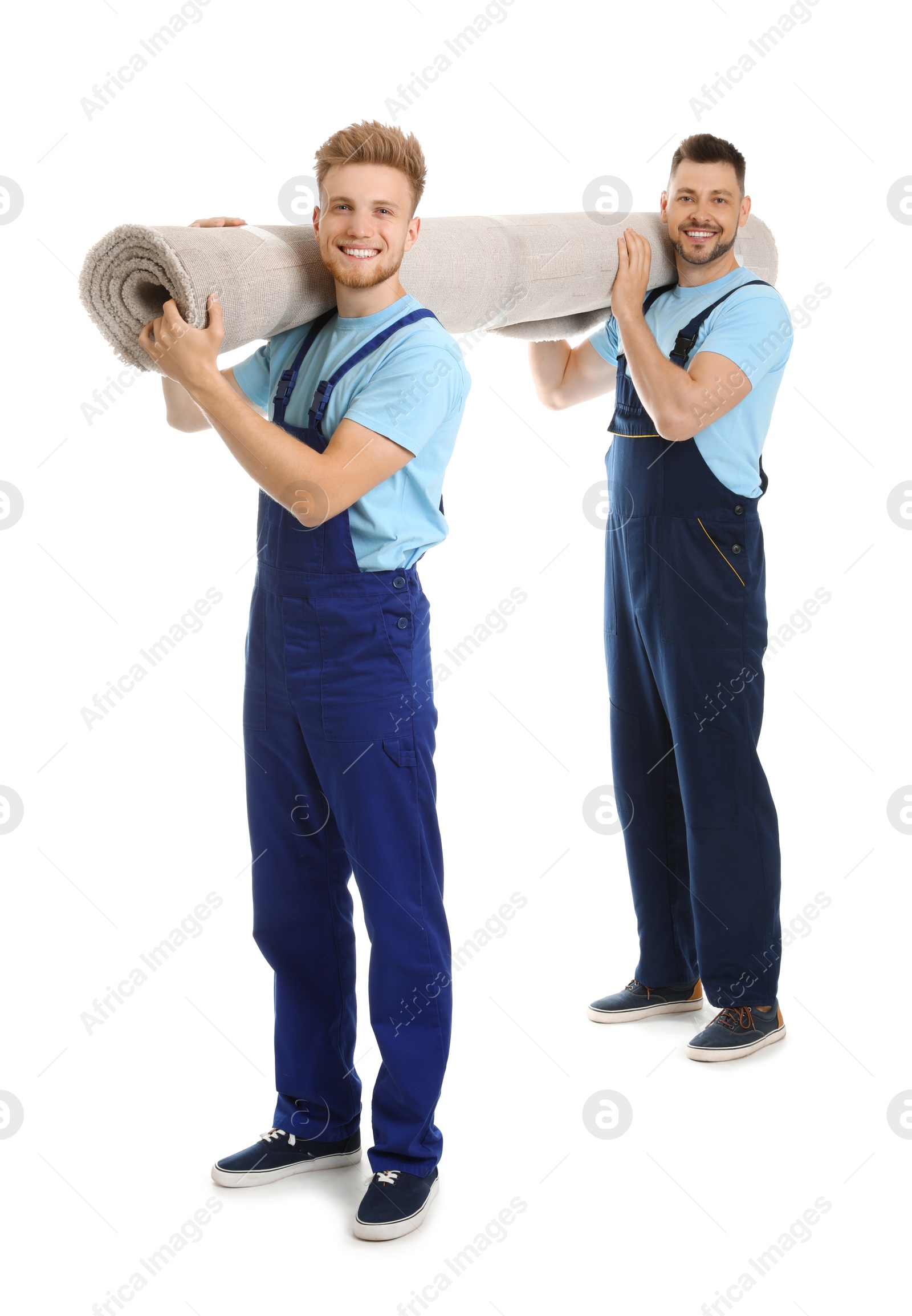 Photo of Portrait of moving service employees with carpet on white background